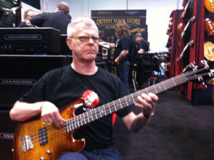 Will Marks trying out a bass at DBZ Guitars