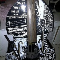 Miles Mosley bass with artwork