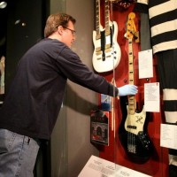 Geddy Lee's bass being installed at Rock and Roll Hall of Fame Musuem